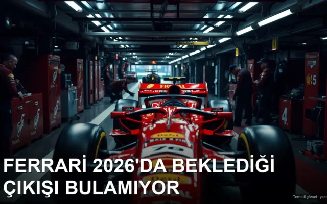 Pit yolunda mekanikerlerin çalıştığı kırmızı yarış aracı
