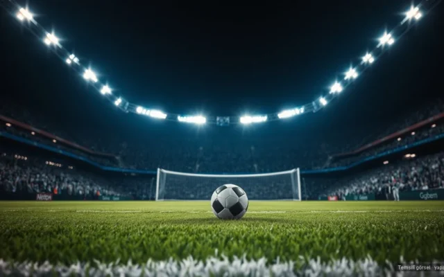 Floodlit stadyumda penaltı noktasındaki futbol topu — Fransa çeyrek finalde