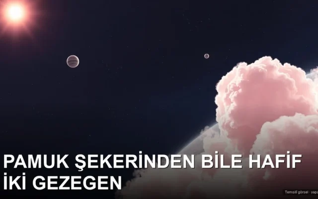 Uzayda pamuk şekeri gibi görünen iki soluk dev gezegen ve yıldızları